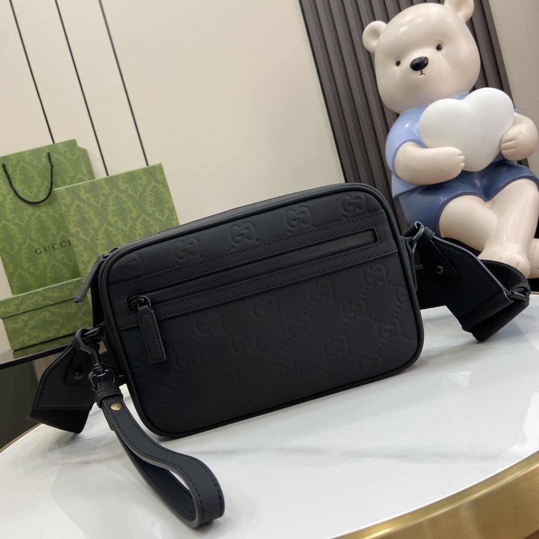 G*u*i crossbody bags a range of men's bags in black rubber effect leather model: 771293. dimensions: 17* 24* 5cm