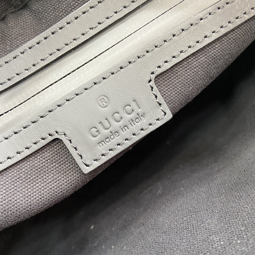G*u*i crossbody bags a range of men's bags in black rubber effect leather model: 771293. dimensions: 17* 24* 5cm